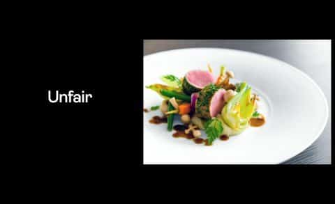 Image with the word "unfair" next to a Michelin Star plate of food.