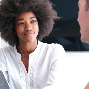 A lady listening intently during an interesting conversation