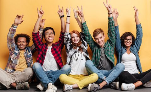 Group of 5 young people smiling