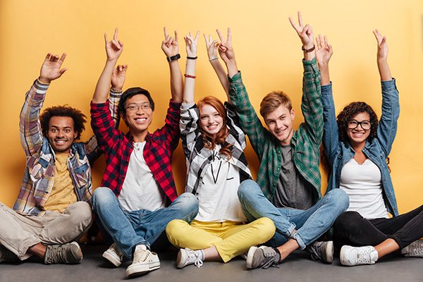 Group of 5 young people smiling