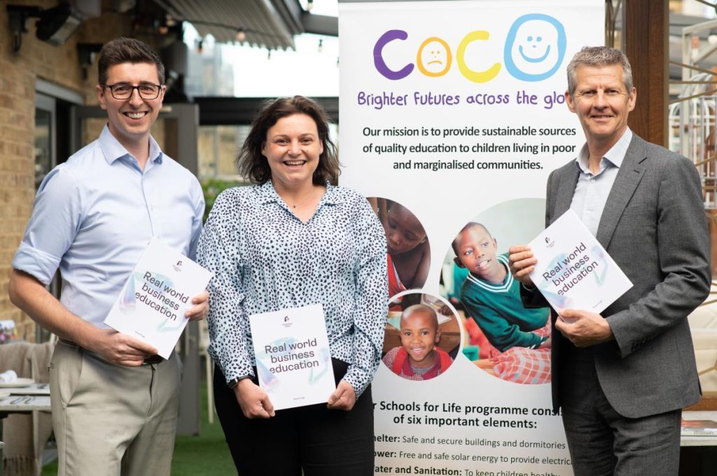 Photo of Roadmap MBA Founder Steve Pugh with Coco charity CEO Lucy and Olympian Steve Cram holding copies of the Roadmap MBA book