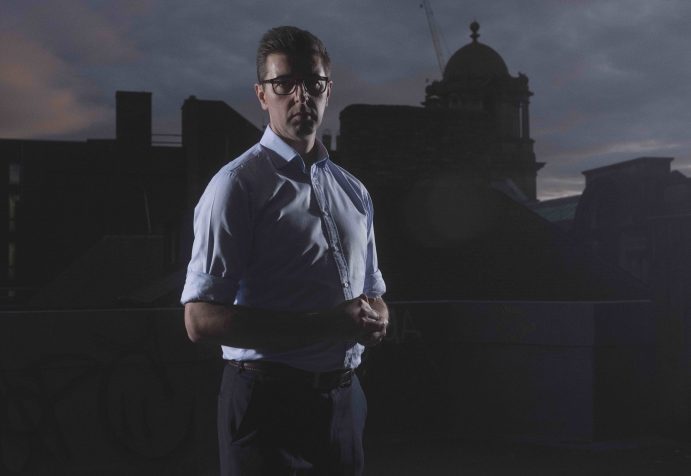 Roadmap MBA founder Steve Pugh stood on a city skyline with dramatic lighting